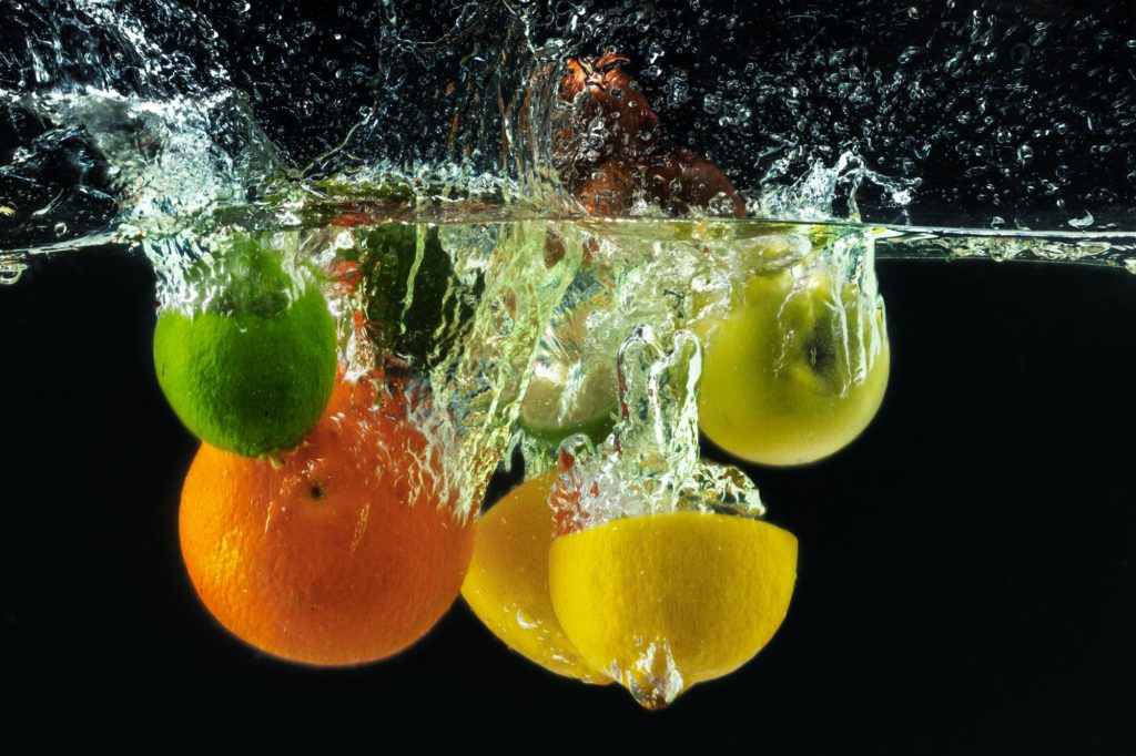 many fruits splashes into water